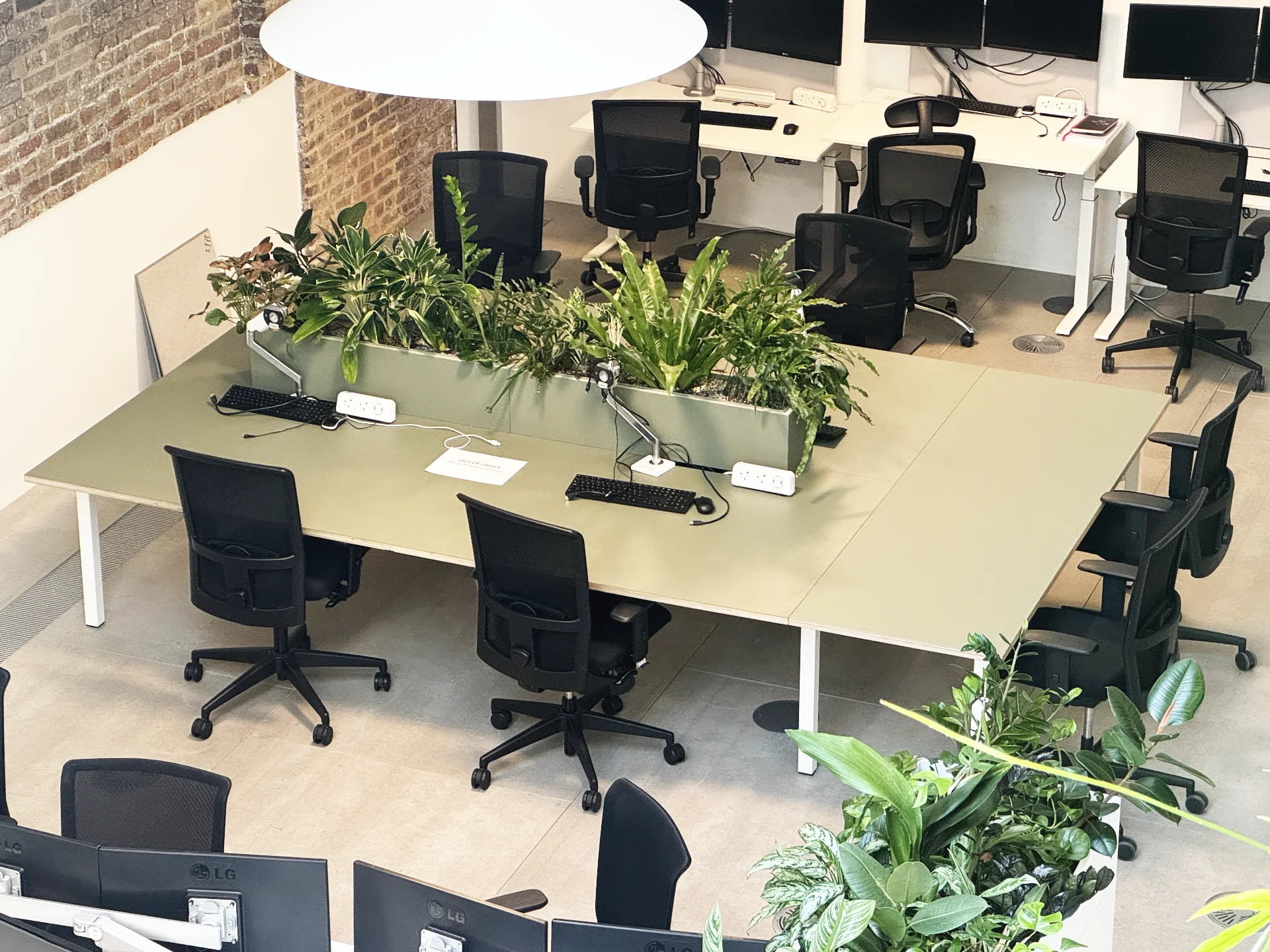 Forbo top and planter designed to fit existing desk frame, creating a breakout table