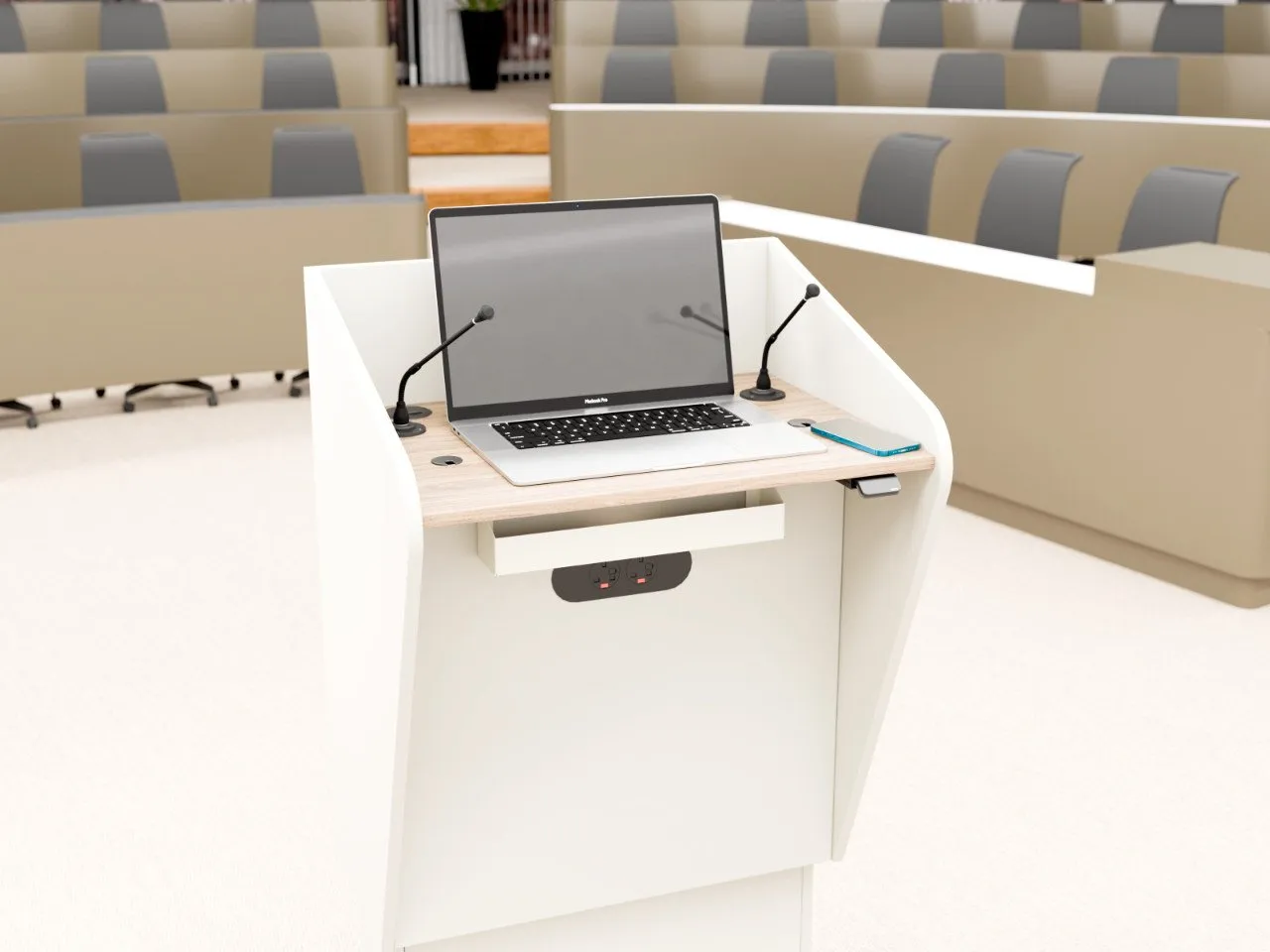 H.A.L. height adjustable lectern in an auditorium setting with AV equipment on display