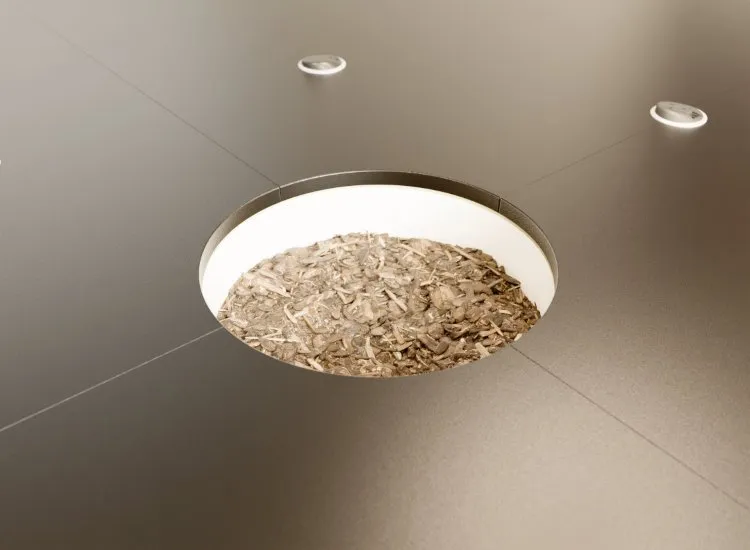 Close-up of Orbital table central planter with waterproof liner and lush greenery