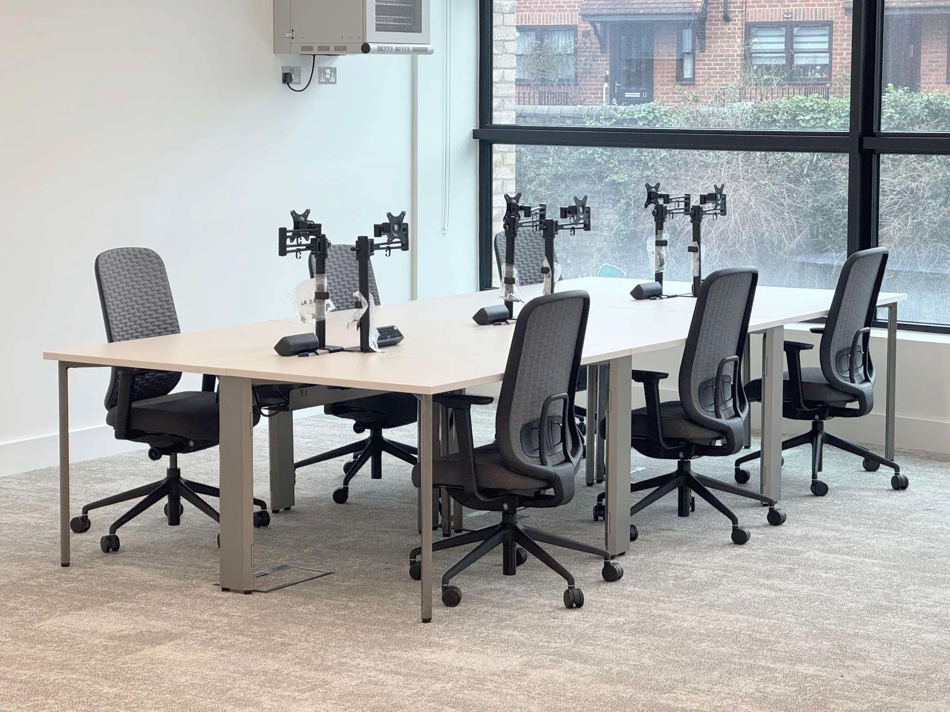 Recon modular desks in a bank of 6 in co-working space